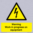 warning-work-in-progress-on-equipmentwith-electrical-hazard-symbol~